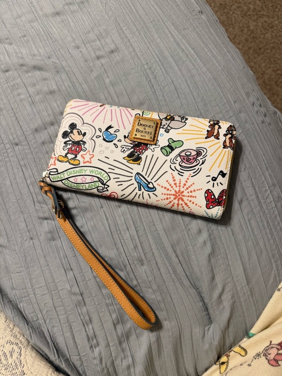 Dooney & Bourke Handbags - Dooney & Bourke Cream Disney Print Wristlet with Tan Strap